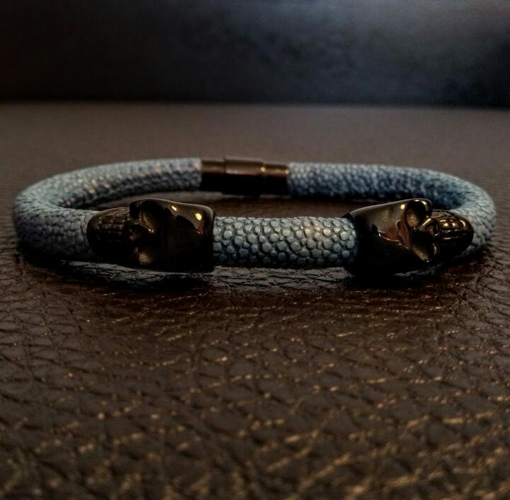Black skull with blue stringray skin
